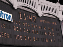 Yankee Stadium scoreboard showing final score at 11:47 pm